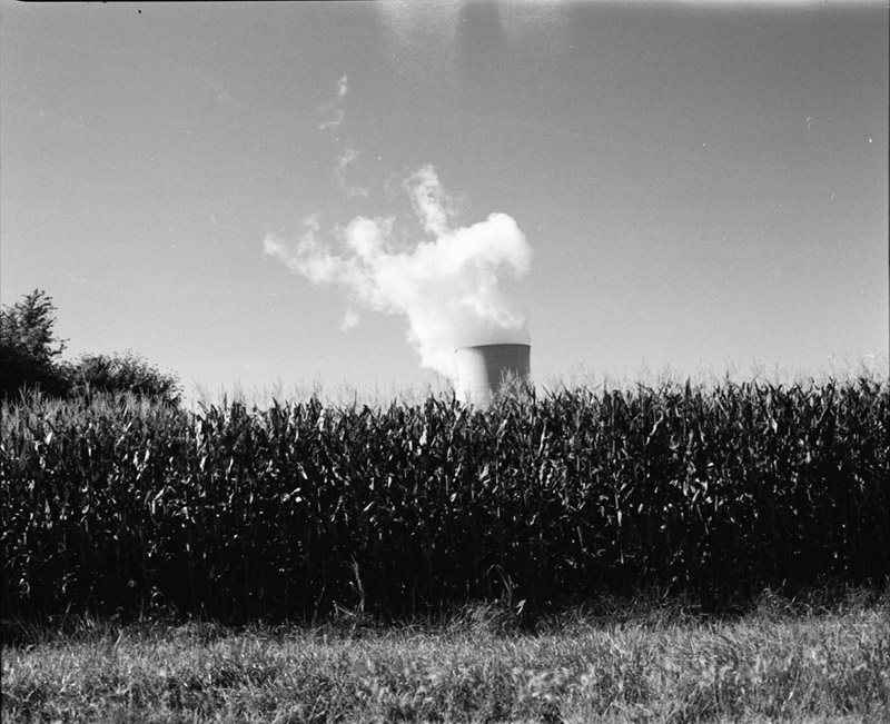 cooling towers over cornfield
