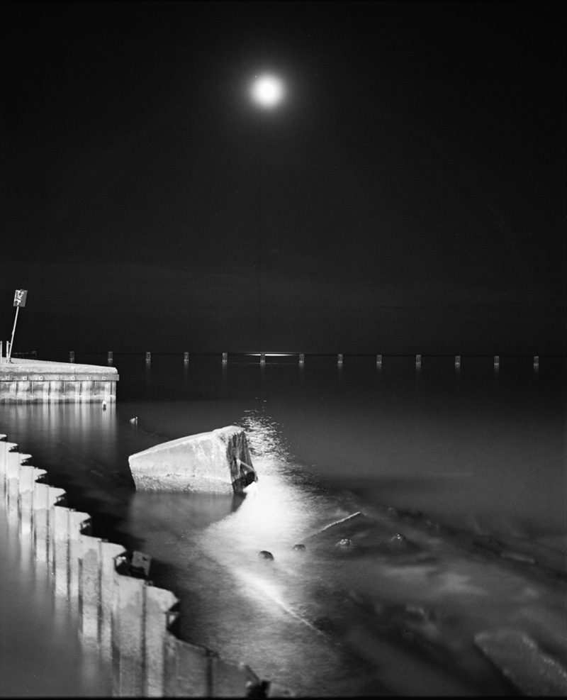 the moon and a disconnected jetty