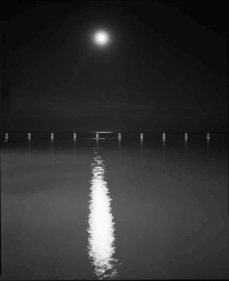 the moon and a line of pilings 2