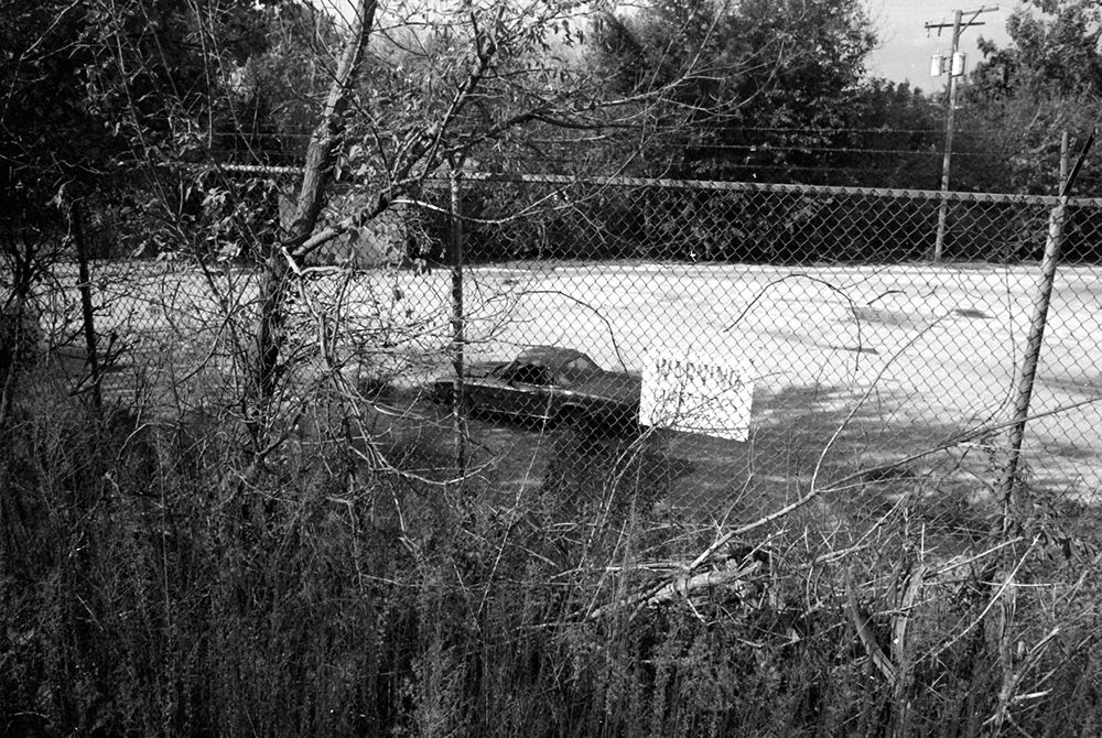 Car Behind a Fence