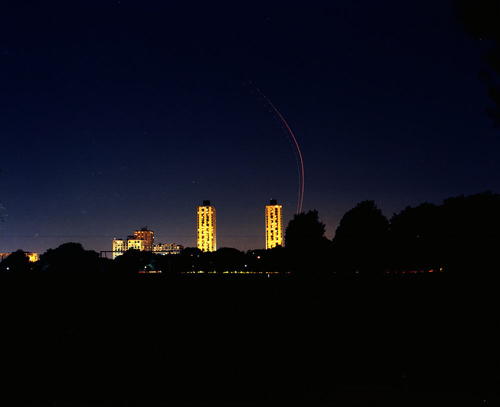 Towers and Plane at Night