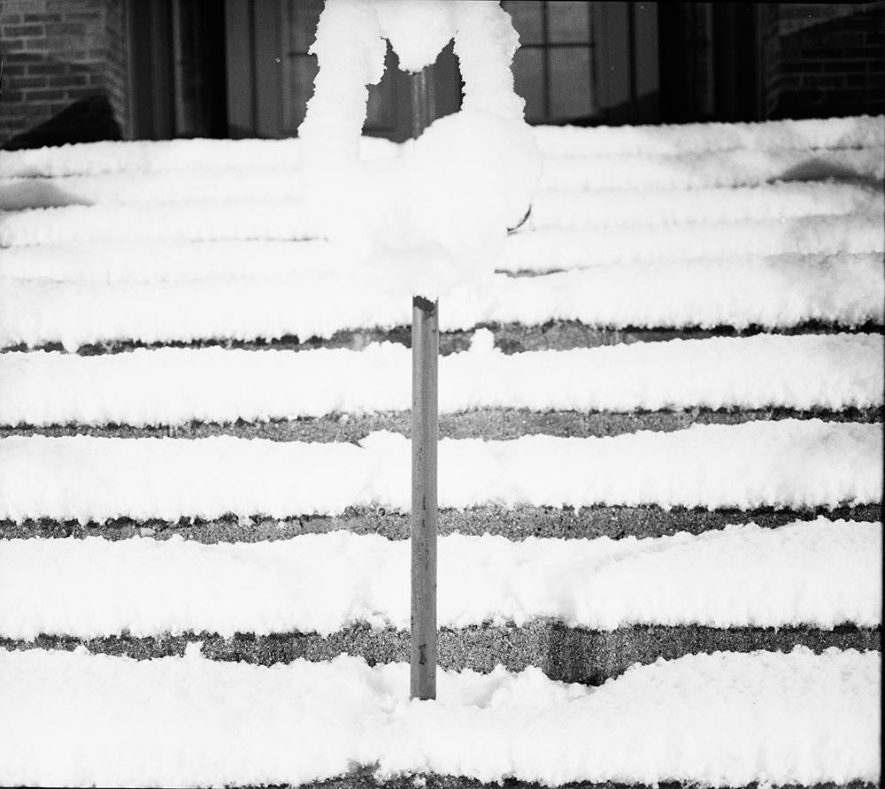 Snow-Covered Stairs and Railing