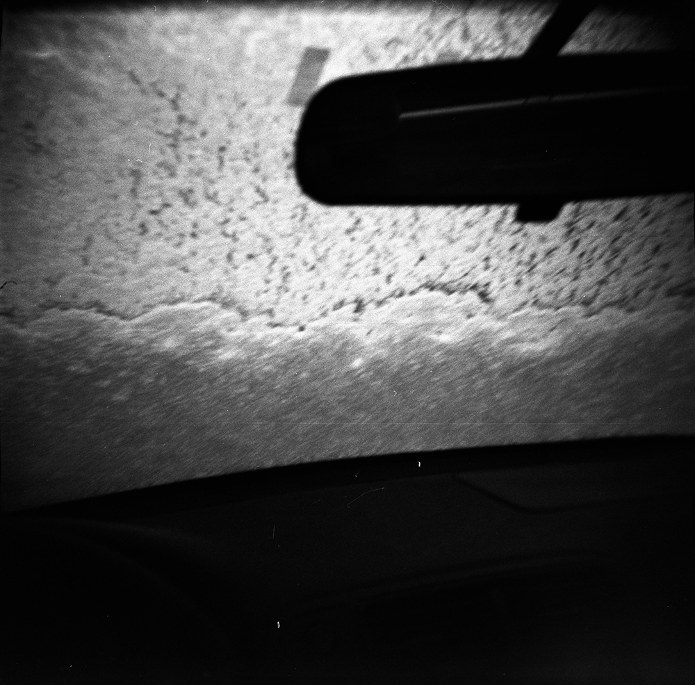 Rear-View Mirror and Snow on the Windshield